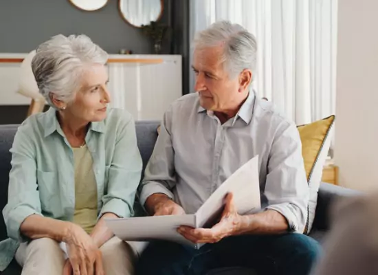 An elderly couple discussing their wills in Peoria IL