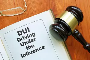 A gavel and DUI information is seen. Brave Law Center P.C. is a DUI Attorney in Peoria IL.